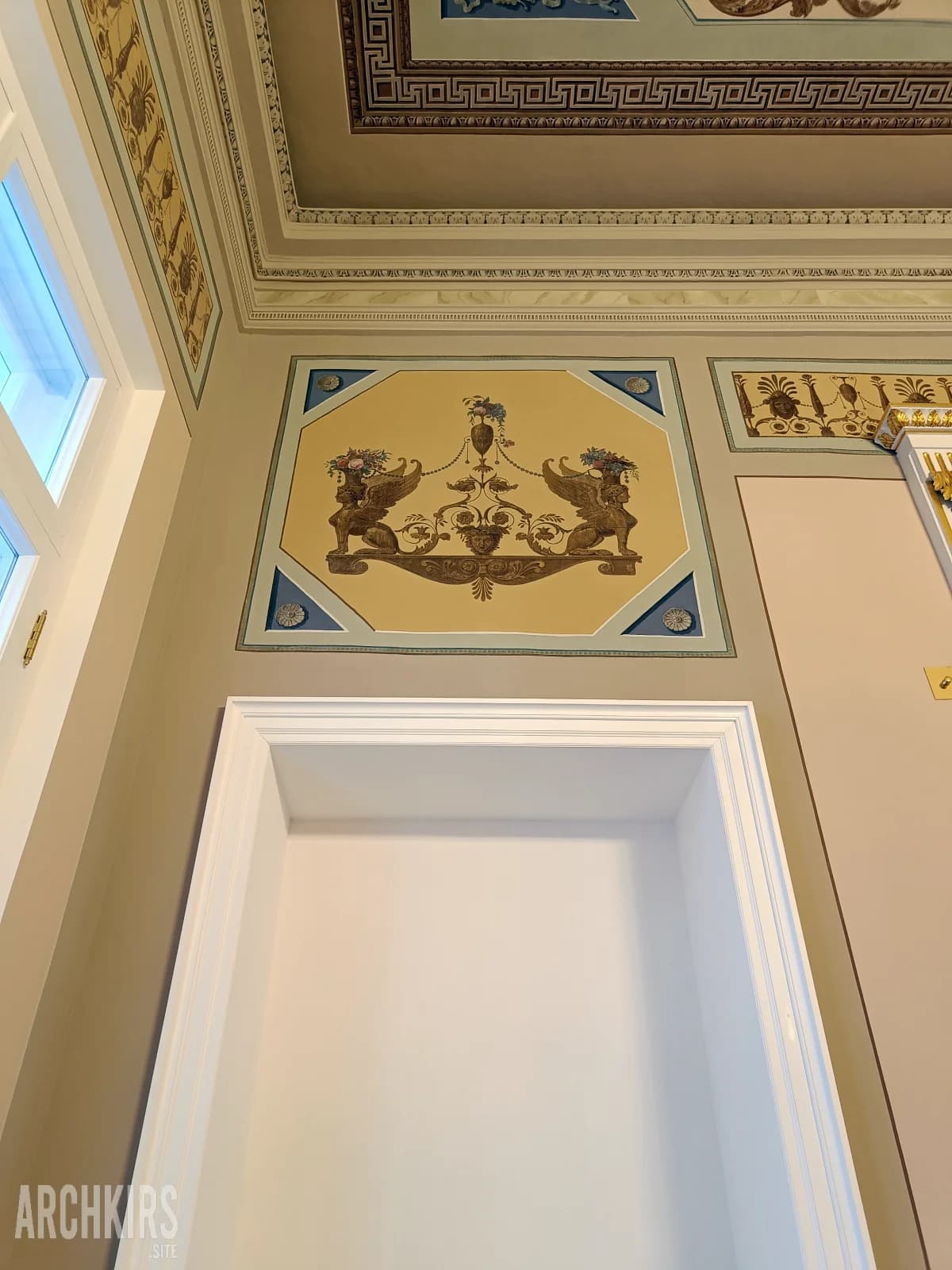 Decorative griffin panel after restoration