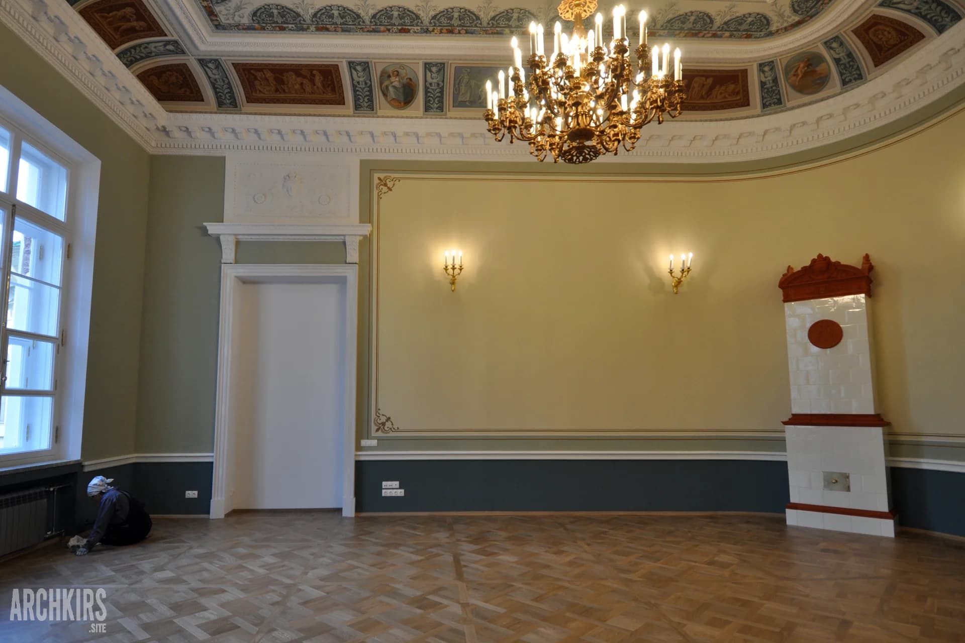 Restored hall wall and tiled stove